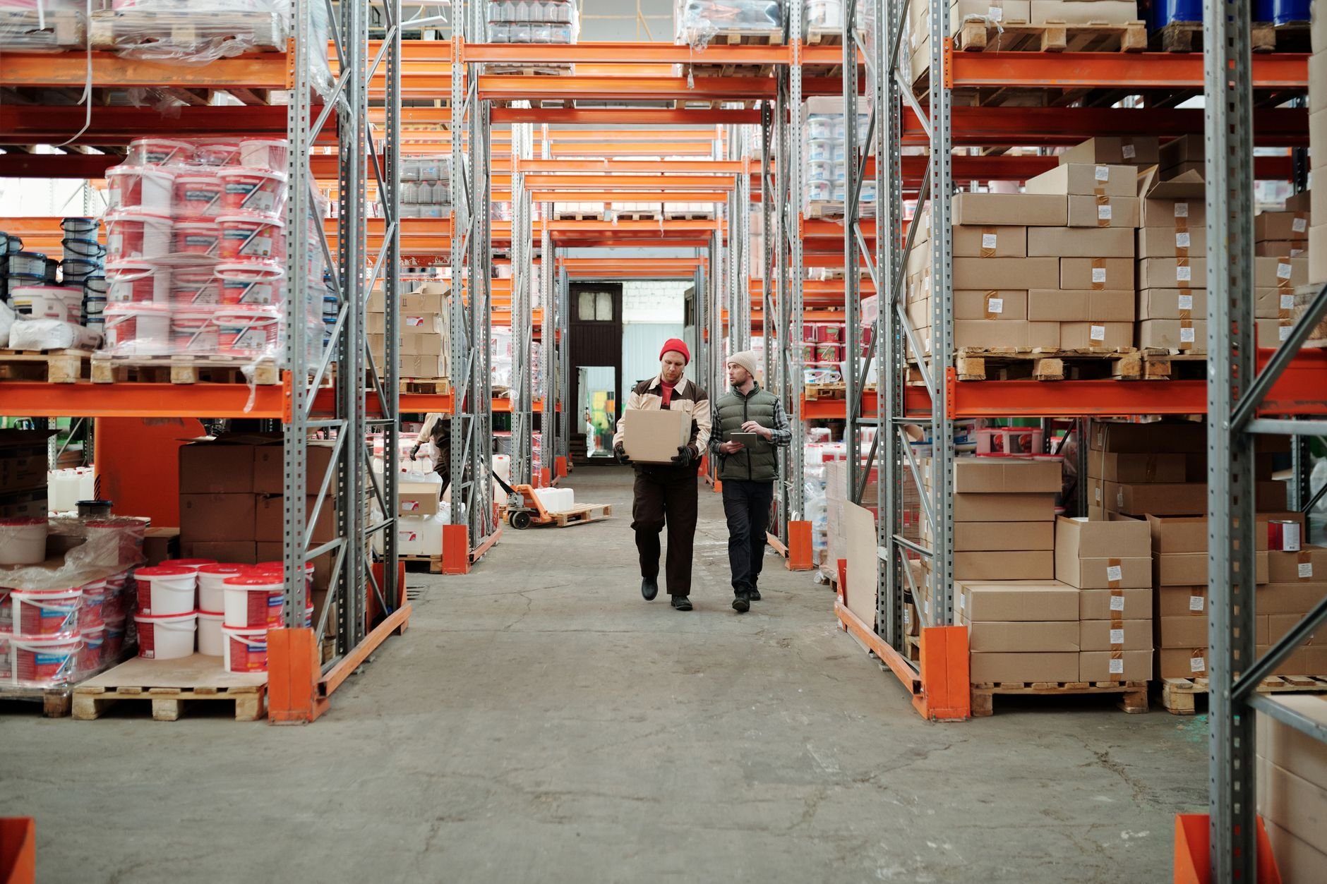 Workers handling packages in a warehouse — fulfilment and shipping operations